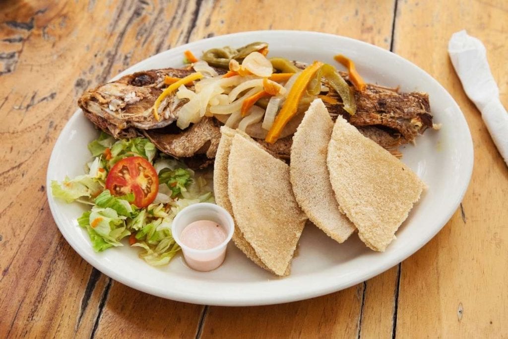 jamaican grilled fish served with bammy, typical easter food