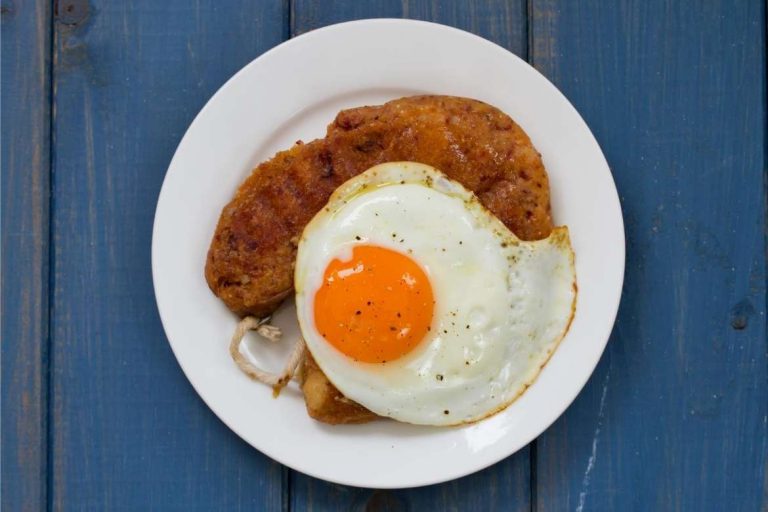 Alheira de Mirandela with a fried egg, traditional dish from Mirandela Portugal