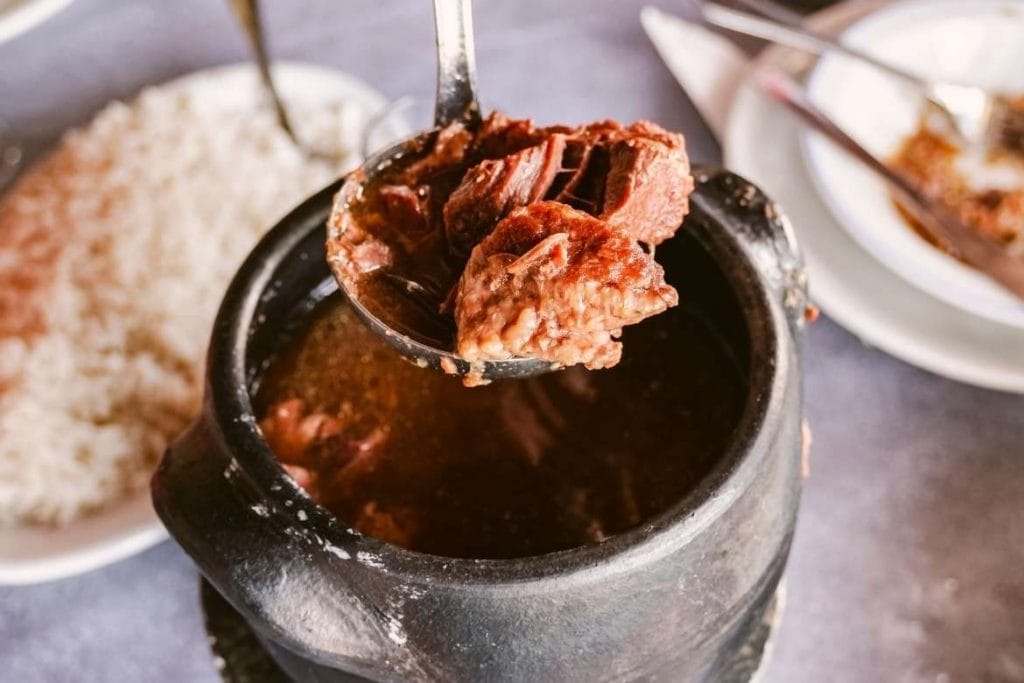 a pot with barreado a traditional dish from southeast Brazil Paraná State