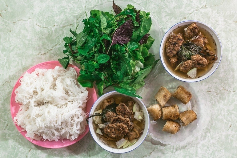 one of most typical Vietnamese food combining fresh rice noodles, pork, broth and fresh herbs