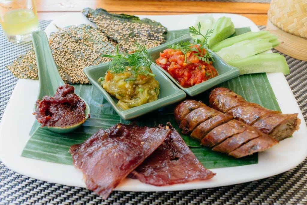 A plate with a variety of Laos Food dishes that represents Lao Cuisine