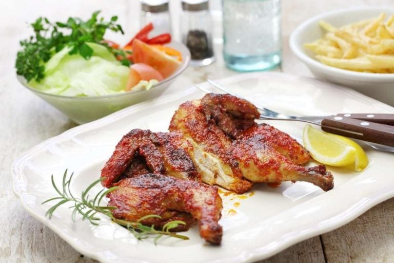 Frango piripiri is a typical portuguese dish consisting of grilled chicken marinated in pepper sauce called piripiri