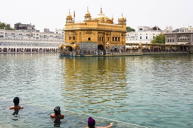 the sarowar is like a pool that surrounds the golden temple for people to bathe as an act of purification