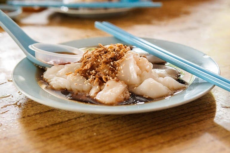 Rice Noodle Roll, a typical malaysian food with soy sauce and brown onions