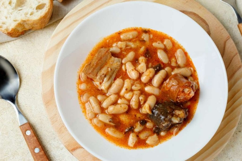 fabadas served on a plate with white beans and sausage is a very traditional and nutritional spanish food