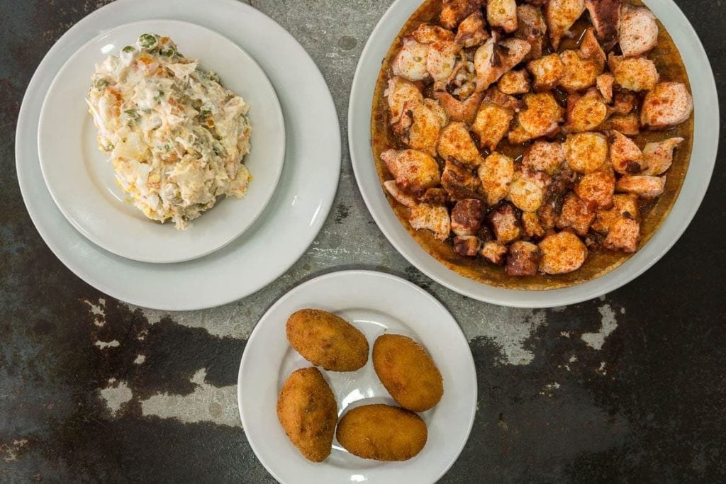 spanish tapas and appetizers with pulpo ocotpus and russian salad