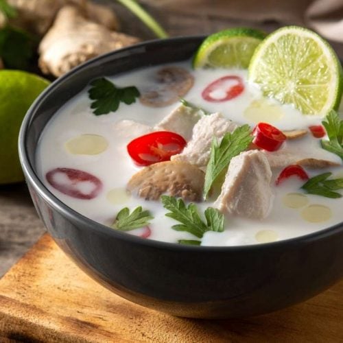 a bowl with tom kha gai typical Thai chicken soup with coconut